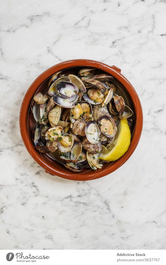 Mussels with fresh lemon juice mussel sprinkle squeeze serve seafood delicious bowl gourmet culinary sour ingredient nutrition dinner organic healthy natural