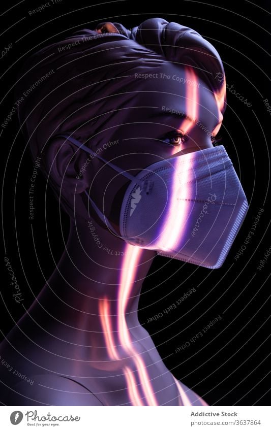 Naked dummy in protective mask in studio mannequin woman coronavirus concept naked medical female plastic illuminate light colorful vivid vibrant multicolored