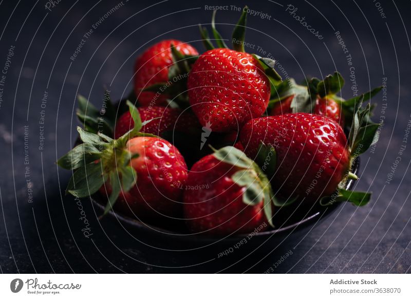 Bowl with ripe fresh strawberries on black background berry strawberry bowl natural food delicious sweet organic healthy dessert vitamin summer tasty juice