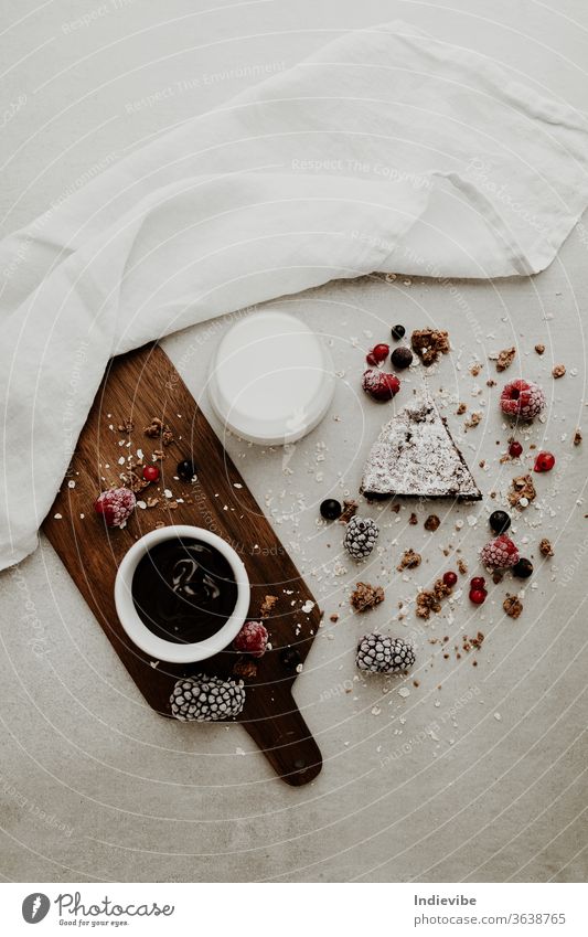 Healthy vegan cake slice with chocolate sauce, milk and berries healthy berry breakfast almond milk blackberry brown background chopping board closeup coconut