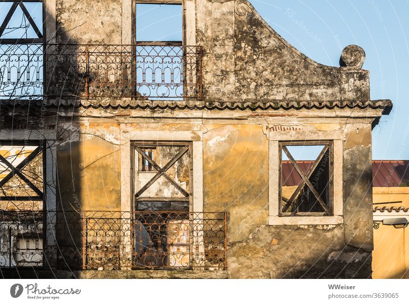 Facade of a destroyed old house in sunlight Ruin House (Residential Structure) Sun Light Window Empty Broken Balconies Lisbon Portugal Wall (building) Old town