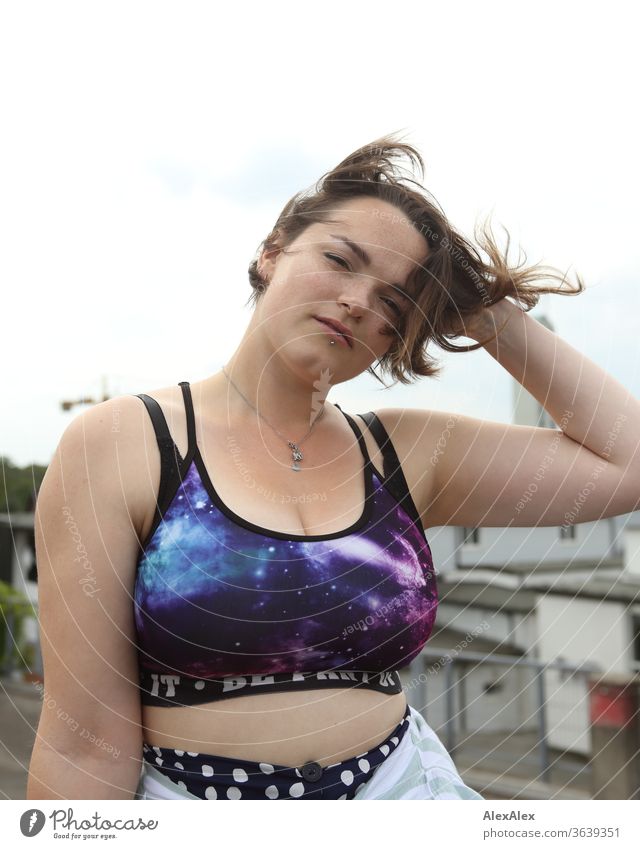 Portrait of a young woman with a belly-free top that runs through her hair Young woman Top windy brunette already Intensive Youth (Young adults) 18-25 years