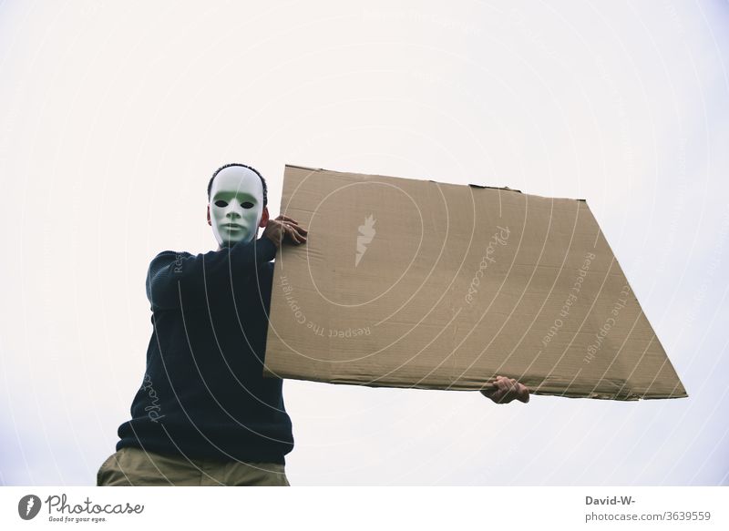 anonymously hold the sign in the air Anonymous Strike Demonstration Mask Advertise Man Advertising Placeholder Freedom of expression masked