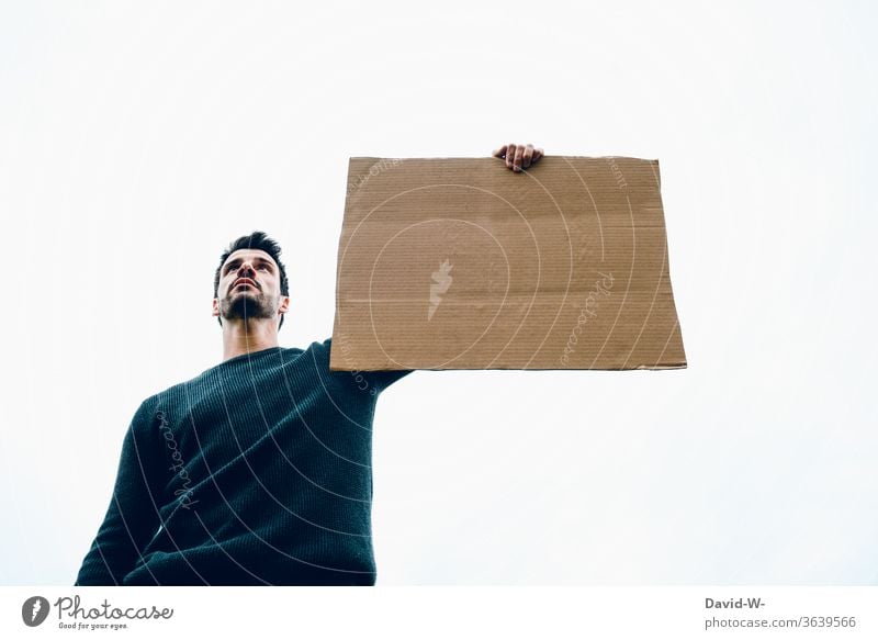 Sign - Man holding a cardboard sign in his hand Cardboard paperboard cardboard box Clue indicative point esteem Opinion Man Held Copy Space Placeholder Demo