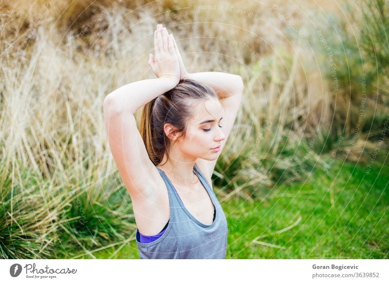 Young woman doing yoga exercise asana balance beautiful beauty body caucasian concentration energy female fitness health healthy lifestyle meditating meditation