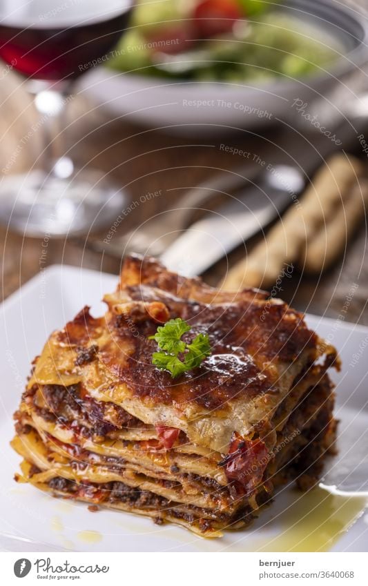 Lasagne on a plate Plate Delicious Minced meat dressed Carbohydrate pasta bake pile Italy European Bolognaise Rustic Tasty ingredient stratified bechamel