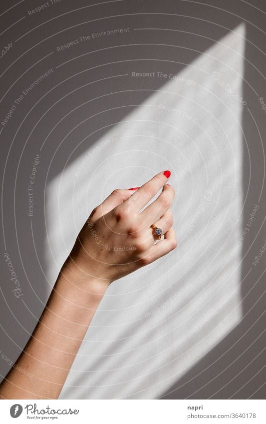 Engaged to be in love... | hand of a young woman with a sparkling diamond ring on her ring finger by hand Young woman Ring engagement ring Betrothal Fingers