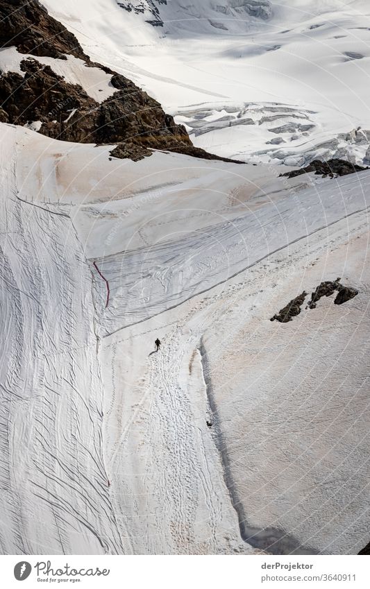 Swiss flag on the Diavolezza glacier in Switzerland St. Moritz Swiss Alps Grisons Engadine wanderlust Hiking trip Class outing nature conservation Endurance