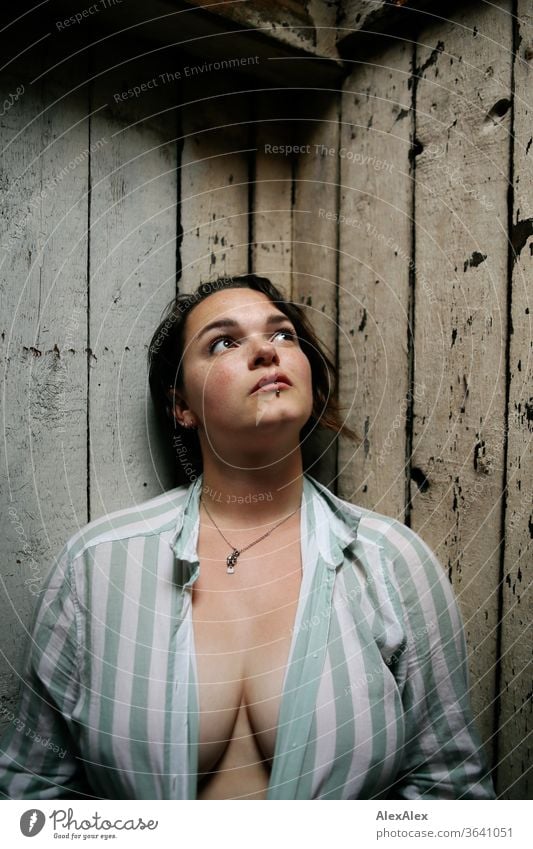 Portrait of a young, freckled woman in front of a wooden wall freckly luck Joy stripe pattern Blouse Model Emotions emotionally sensuality Exceptional Freckles