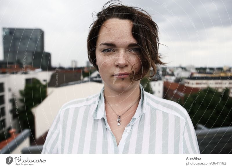 Portrait of a young, freckled woman on a roof Young woman Top windy hair brunette already Intensive Youth (Young adults) 18-25 years décolleté