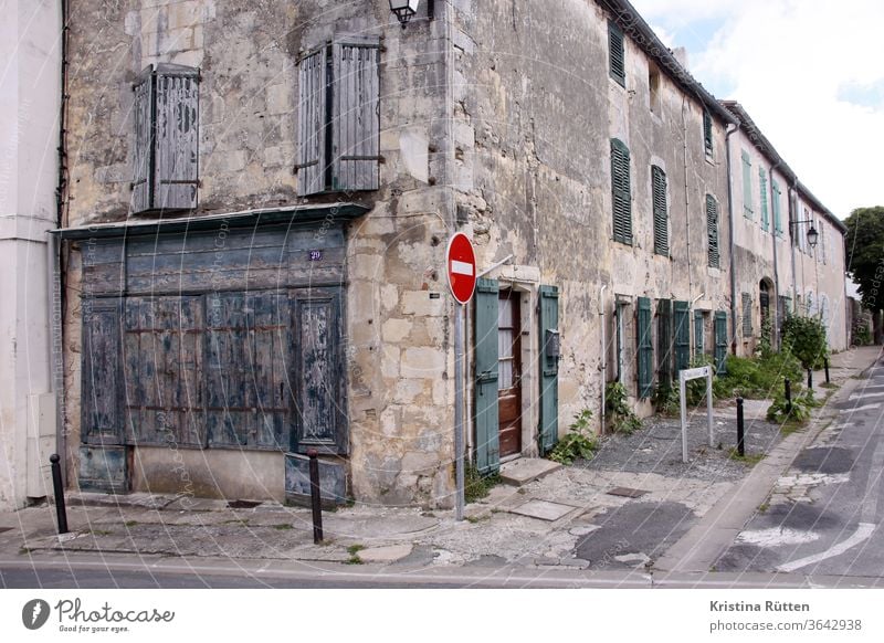 street corner in saint-martin-de-ré houses Housefront Old building row houses Residential buildings built Facade shutters Closed Architecture Street street sign