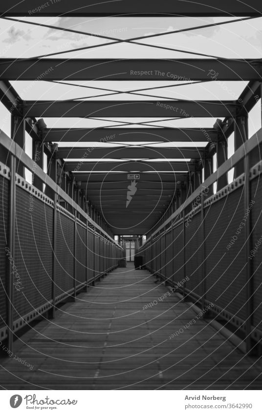 Black and white empty walkway with symmetry abstract architecture background beautiful black boardwalk bridge building city concept construction design