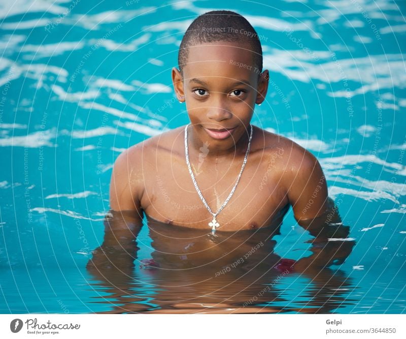 Boy in the swimming pool adorable baby beach beautiful blond blue boy caucasian child childhood children concept family floater floats handsome infant innocence