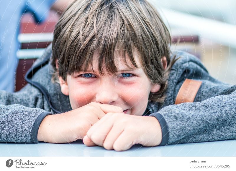 fortunate Exterior shot Dreamily Daydreamer Laughter Grinning Impish Love Happy Son Contentment pretty Charming allure Smiling Sunlight Child Close-up portrait