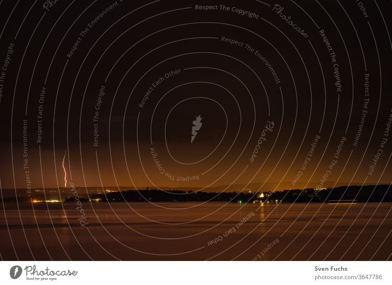 A thunderstorm over the Bodensee provides for a beautiful play Thunder and lightning Lake Constance lightning bolt Clouds Water Gale Storm Idyll Nature