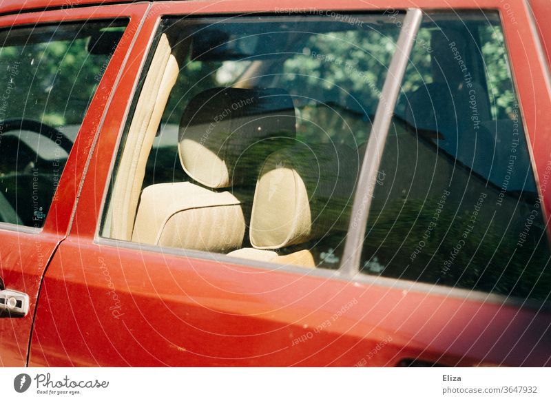 View into an old red car with beige leather seats Vehicle Old Red Retro Car Means of transport inboard interior equipment Summer Car Window Slice Window pane