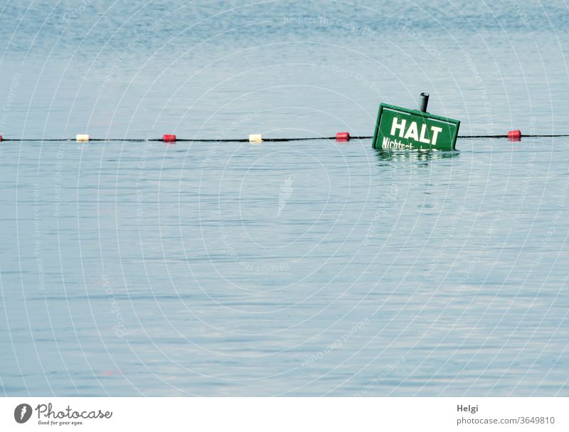 HALT - half-submerged warning sign with barrier rope at the end of a non-swimmer area in the lake Water Lake cordon holds Non-swimmer Warn Caution peril