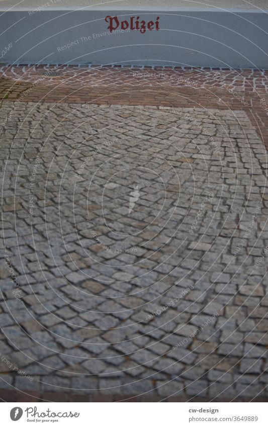 paved police parking lot Characters Colour photo Sign Deserted Detail Exterior shot Copy Space bottom Copy Space left Copy Space right Relationship