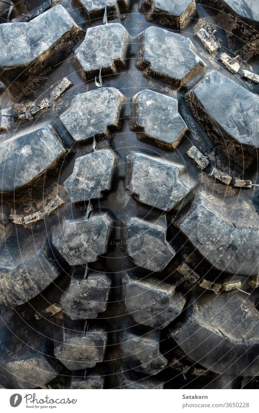 The texture of Centipede pattern mud terrain tire, Old used tires track dirty transport transportation wheel vehicle old surface rubber trail black trekker big