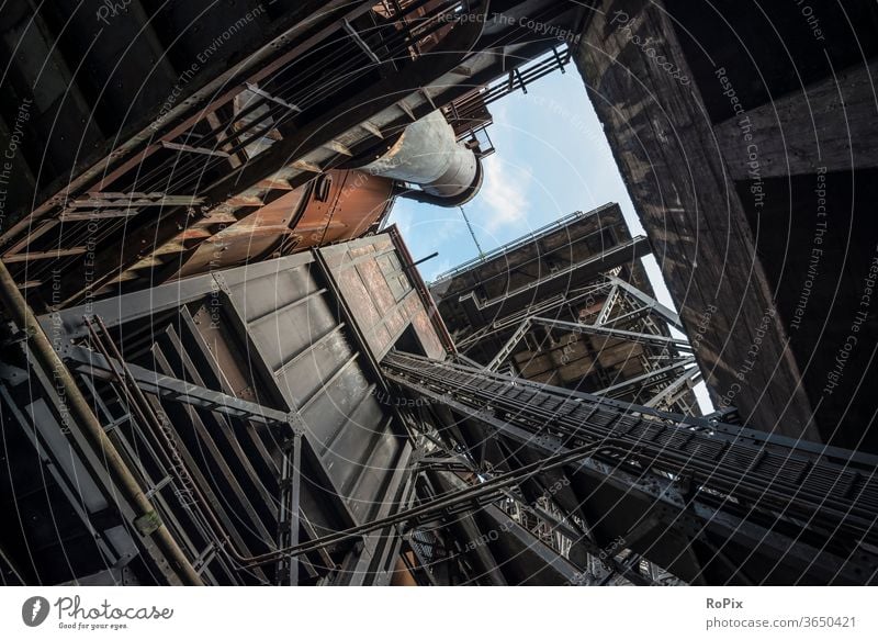 Inclined elevator at blast furnace 5 in Duisburg North. Silo Factory Process Technology Screw Lime Tank Industry Ground Funnel Fastening Gearwheel Gear rim