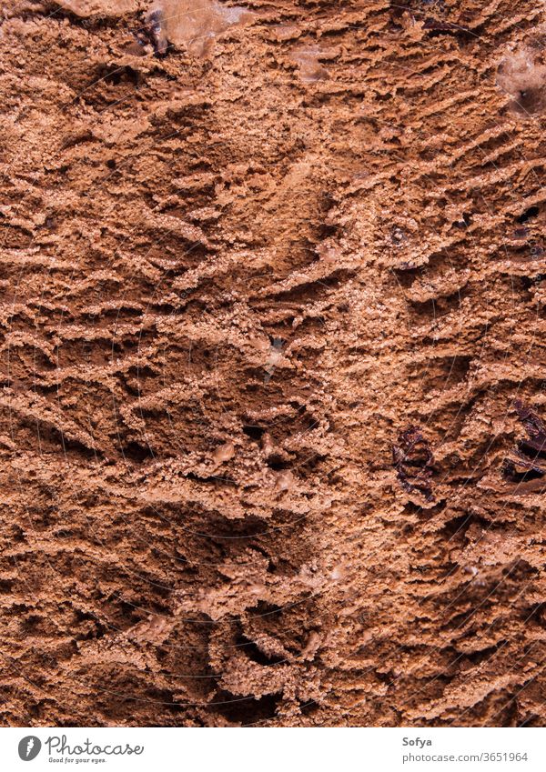 Chocolate ice cream texture background macro chocolate above tub sweet food dessert summer delicious dark indulgent temptation sugar treat fat inside vertical