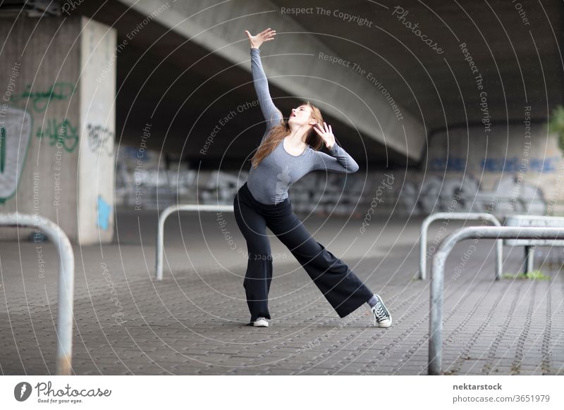 Modern Dancer in Pose on Sidewalk female dancer modern dance sidewalk one person girl young woman caucasian ethnicity youth culture full length