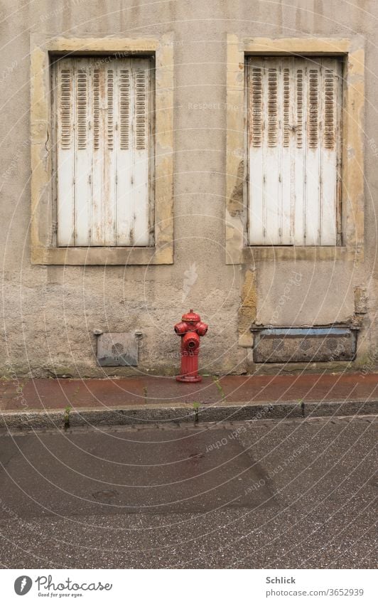 House facade in Lorraine Metz with hydrant in rainy weather House (Residential Structure) Window Facade two folding shutter Closed Fire hydrant metz