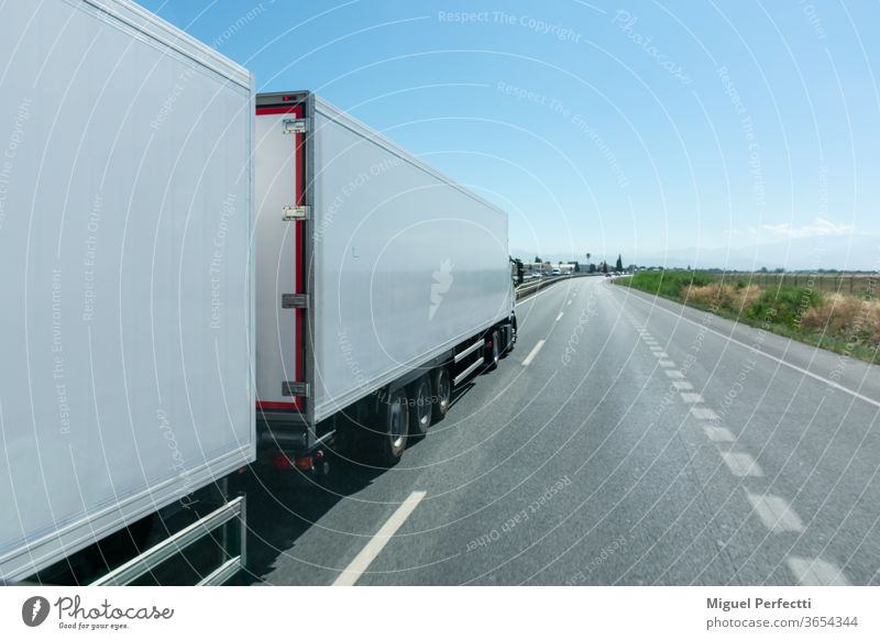 Mega-truck or Road train, special vehicle consisting of a truck and two trailers approved to transport 60 tons. mega truck road train refrigerated transport