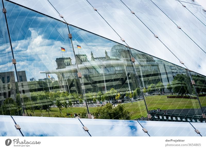 Reflection of the government quarter in the Cube at the main station Worm's-eye view Deep depth of field Sunlight Light (Natural Phenomenon) Copy Space middle