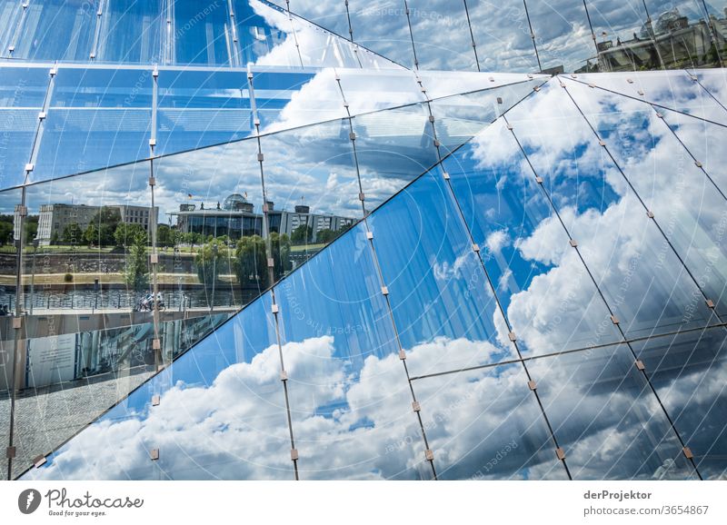 Reflection of the government quarter in the Cube at the main station Worm's-eye view Deep depth of field Sunlight Light (Natural Phenomenon) Copy Space middle