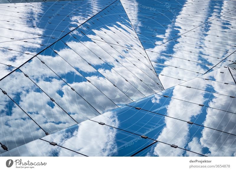 Cloud reflections in the Cube at the main station Worm's-eye view Deep depth of field Sunlight Light (Natural Phenomenon) Copy Space middle Copy Space bottom