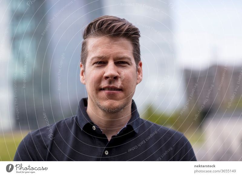 Portrait of Man in Blurred Urban Background caucasian headshot face portrait buildings selective focus Frankfurt Germany urban handsome model one person