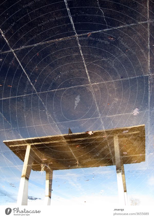 Table tennis table from below from above Wet Leisure and hobbies Sky Clouds outdoor Reflection Sports Ground Paving tiles disorientation optical illusion