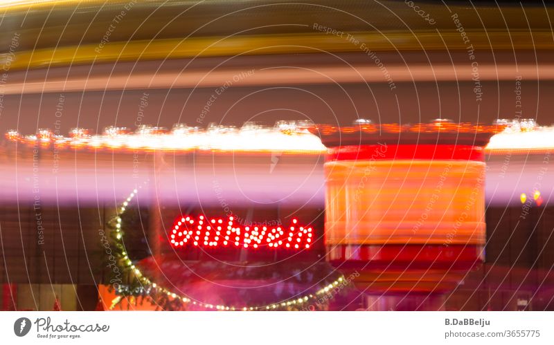 The mulled wine stand at the Christmas market attracts visitors with its scent and neon sign. clearer Mulled wine Christmas & Advent Winter Hot drink Tradition