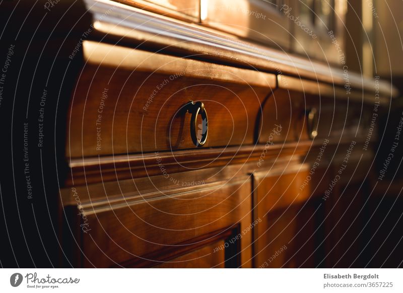 Close-up of drawers with ring handles of an old buffet cupboard made of cherry wood Drawers Buffet Ring handles Buffet cabinet Old Cherry tree wood Cupboard