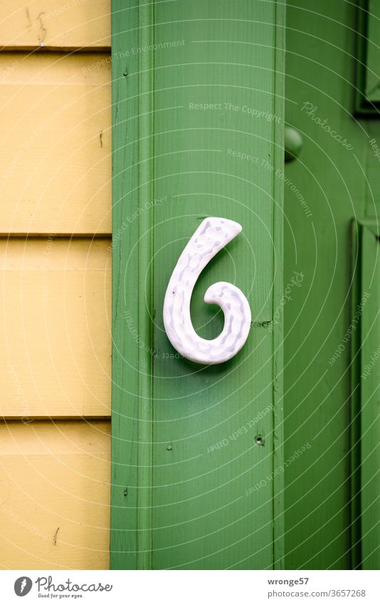 House number 6 at a residential house in Wernigerode Digits and numbers Location Wall (building) House (Residential Structure) Signs and labeling Exterior shot