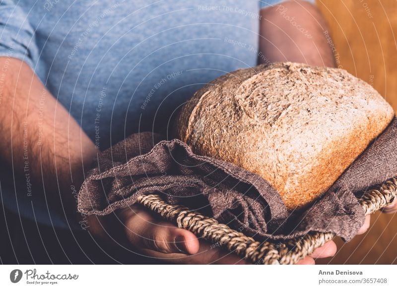 Homemade wholemeal bread homemade organic nutrition healthy fresh food grain loaf bake sliced crust traditional delicious brown dark wheat flour bakery board