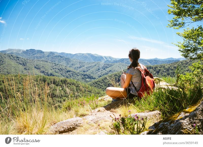 Hiker girl enjoying the nature in summer people mountain freedom hiking alone landscape Artikutza Basque Country trekking woman hiker travel journey