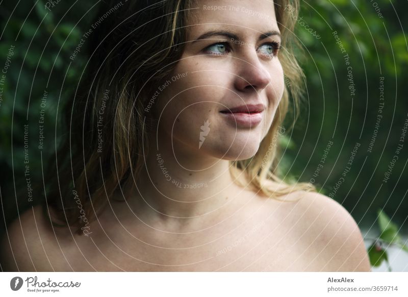 Close portrait of a young woman in front of a forest Curly White Purity luck Beautiful weather Trip Expectation Sunlight Joy Close-up Feminine Day