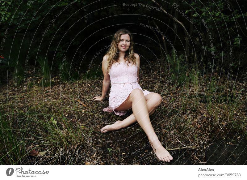 Close portrait of a young woman in front of a forest Curly Purity luck Beautiful weather Trip Expectation Sunlight Joy Close-up Feminine Day