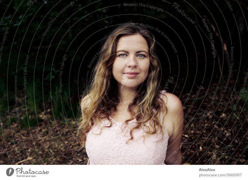 Close portrait of a young woman in front of a forest Curly Purity luck Beautiful weather Trip Expectation Sunlight Joy Close-up Feminine Day