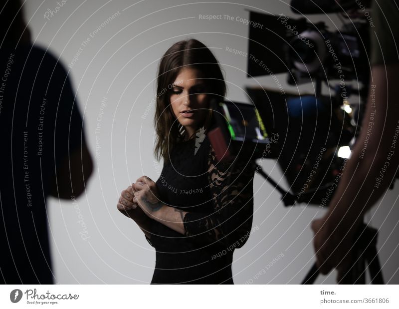 On set (1) temporising portrait actress Meditative Head countersunk Dress hair feminine Woman Scene camera Screen arm work Concentrate Artificial light