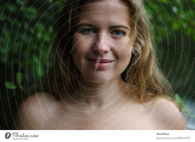 Close portrait of a young woman in front of a forest Curly White Purity luck Beautiful weather Trip Expectation Sunlight Joy Close-up Feminine Day