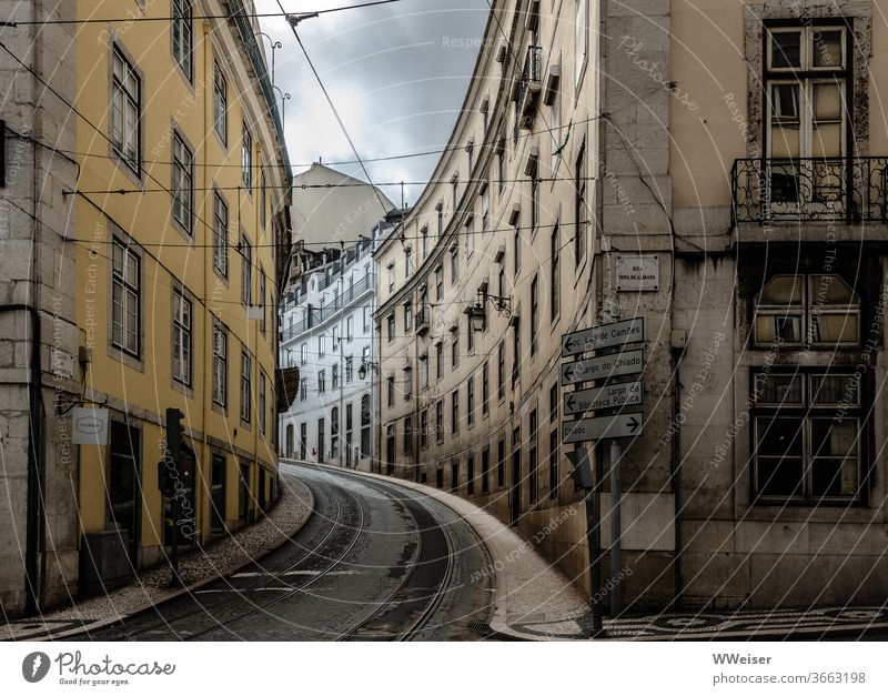 Empty street in Lisbon Street Curve Portugal Town Vacation & Travel Tourism Capital city City trip Tram Railroad tracks Deserted Rainy weather Signs houses