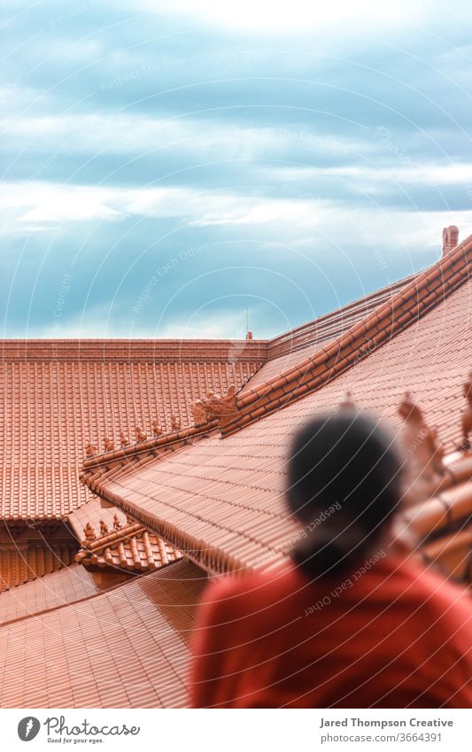 A Buddhist temple, overlooked by a young woman. buddhist peace zen china asia asian Architecture Spiritual Culture Ancient pray Terracotta Buddhism Buddha