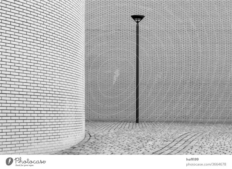 the lamp brings enlightenment - the rounding hides, but the whole thing is a boon to the viewer of minimalist scenes Lantern Lamp post Wall (building)