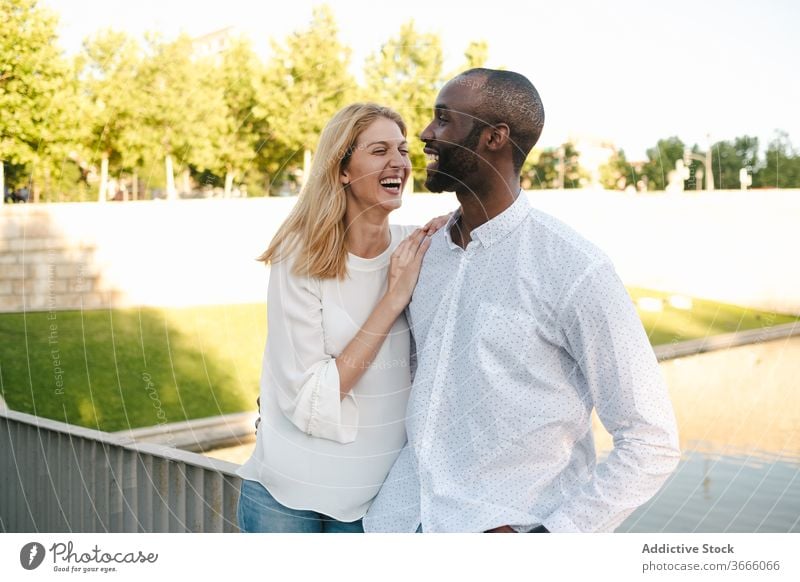 Tender multiracial couple hugging each other lovingly bonding rest in love romantic content tender sensual eyes closed cuddle happy cheerful fondness affection