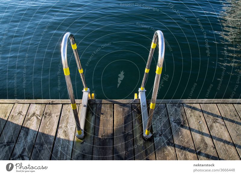 Decking ladder at Oslo riverside High angle view lake pier Norwegian Norway outside outdoors day detail close up metal accessibility wooden terrace decking