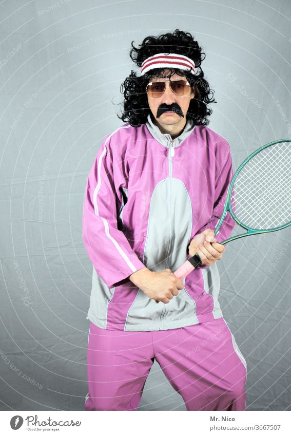 Contemporary History I 80s Leisure and hobbies Tennis rack Tracksuit bottoms Old-school Retro Fashion Pink Tennis player Posture Black-haired Headband