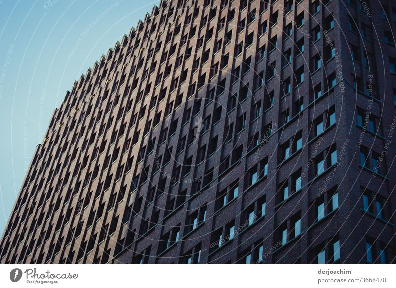 Berlin skyscraper partly with shadow and sun. Quite a lot of windows. High-rise Architecture Town Building Facade Deserted Exterior shot Day Colour photo Window